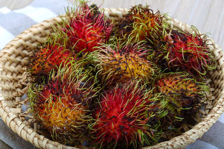 Fresh ripe sweet rambutan in the basketの写真素材