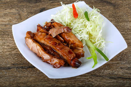 Teriyaki chicken with herbs and spices served cabbageの写真素材