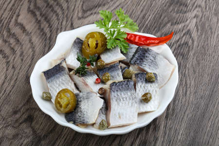 Herring fillet with capers, parsley and pepperの写真素材