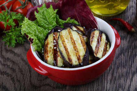 Grilled eggplant with olive oil and salad leavesの写真素材