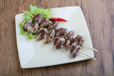 Chicken hearts skewer barbeque with herbs and spicesの写真素材