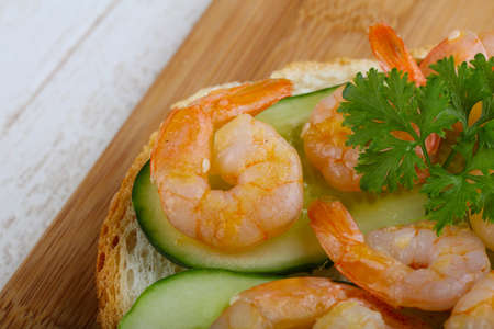 Sandwich with cucumbers and prawn serwed parsleyの写真素材