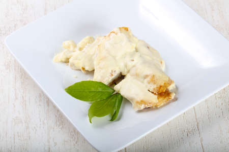 Baked perch in cream sauce with rosemaryの写真素材