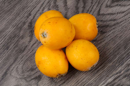 Fresh ripe Meldar on the wood background