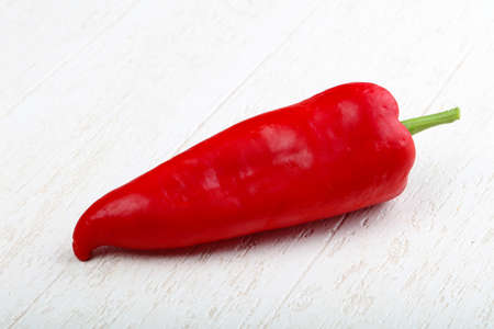 Red romano pepper on the wood backgroundの写真素材