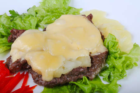 Roasted Pork with pineapple and cheese served salad leavesの写真素材