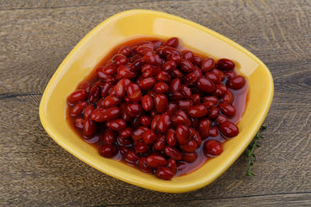 Red canned kidney beans on the wood backgroundの写真素材