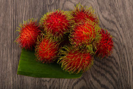 Fresh ripe sweet Rambutan heap - asian fruitの写真素材