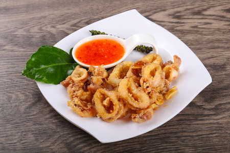 Fried squid rings with hot spicy sauceの写真素材