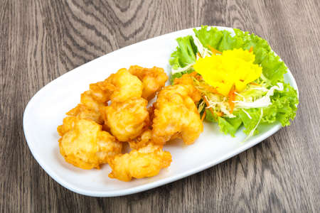 Squid tempura - Asian style cuisine on wood backgroundの写真素材