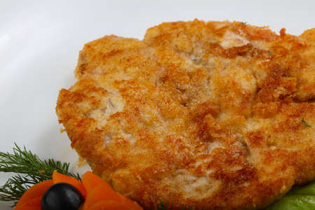 Chicken schnitzel served salad leaves and dillの写真素材