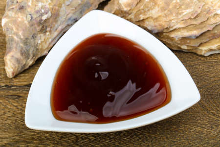 Oyster sauce in the bowl with shellの写真素材