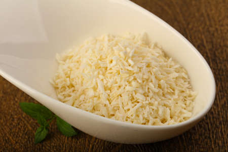 Coconut flakes in the bowl with mint leavesの写真素材