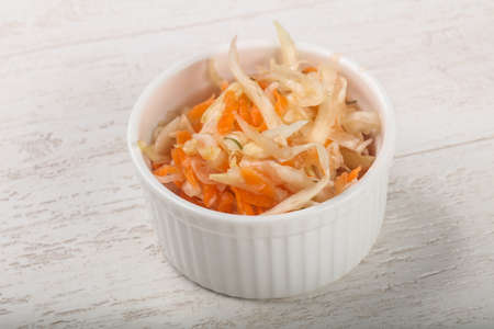 Raw pickled cabbage on wood backgroundの写真素材