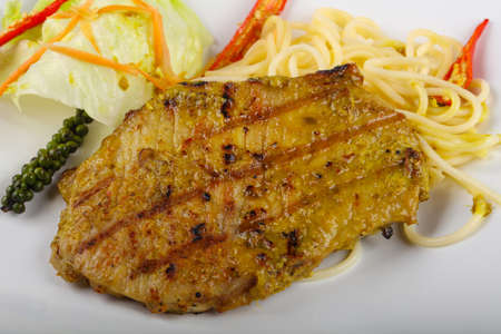 Grilled pork meat with green curry and pepperの写真素材