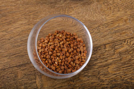 Raw buckwheat  in the bowl ready for cookingの写真素材