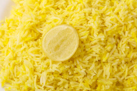 Indian traditional cuisine - Yellow Rice with Limeの写真素材
