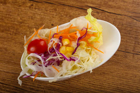 Fresh cabbage salad with carrot and tomatoの写真素材