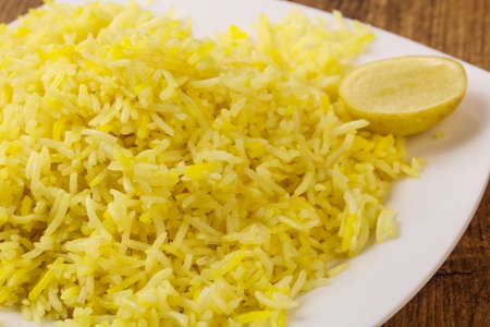 Indian traditional cuisine - Yellow Rice with Limeの写真素材