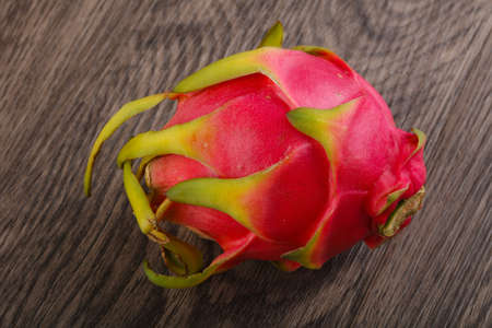 Famous Tropical Dragon fruit on the wood backgroundの写真素材