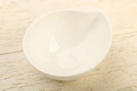 Empty plate for home or restorant over wooden backgroundの写真素材