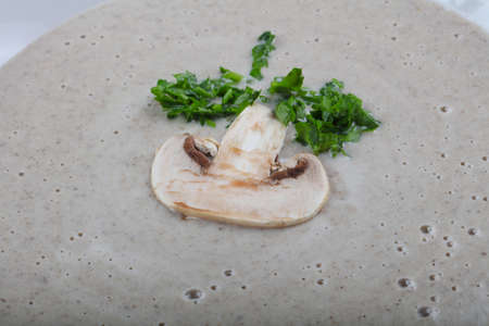 Mushroom cream soup with parsley and croutoonの写真素材