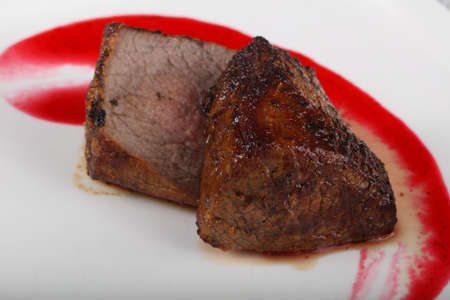 Rib-eye steak with sauceの写真素材