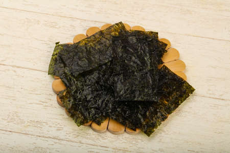 Crispy Nori sheets chips over wooden backgroundの写真素材
