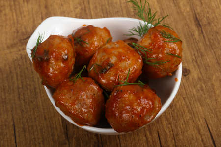 Meat balls in tomato sauce served dill
