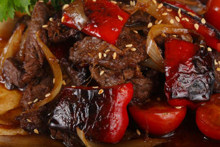 Beef in oyster sauce with tomatoの写真素材