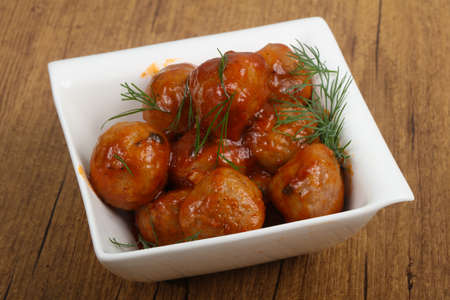 Meat balls in tomato sauce served dillの写真素材
