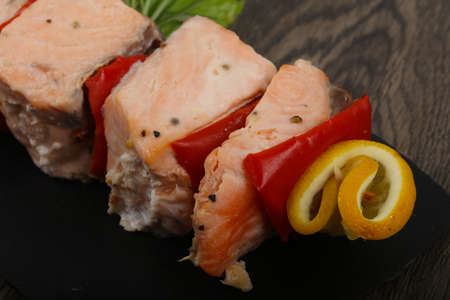 Salmon Skewer with pepper and lemonの写真素材
