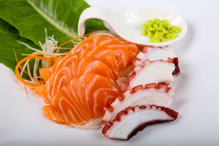 Fresh cold Salmon and Octopus sashimi with wasabiの写真素材