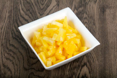 Canned pineapple in the bowlの写真素材