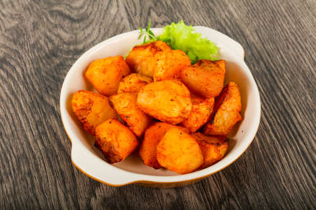 Baked potato with herbsの写真素材