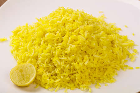 Indian traditional cuisine - Yellow Rice with Limeの写真素材