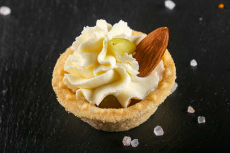 Tartlet with cheese cream and almondの写真素材