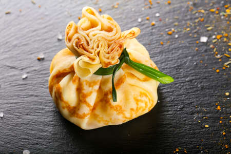 Stuffed pancake bags with meat and onionの写真素材