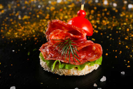 Canape with salami for cateringの写真素材