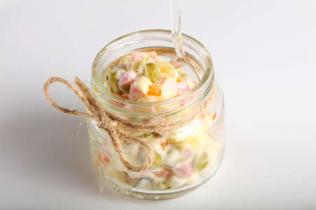 Russian salad served in the glass canの写真素材