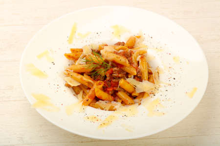 Penne bolognese with parmesan cheeseの写真素材