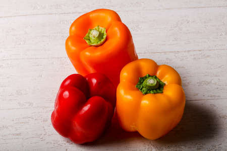 Raw bell pepper - ready for eating over wooden backgroundの写真素材