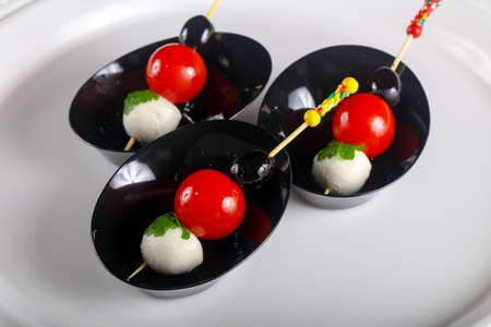 Canape with tomato and mozarella cheeseの写真素材