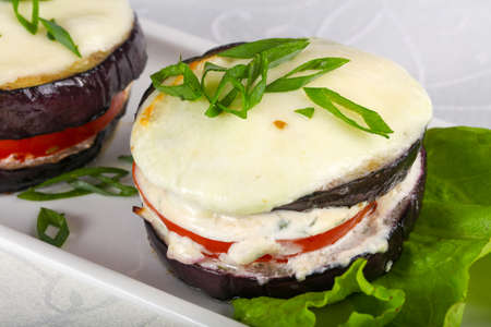 Baked eggplant with tomato and cheeseの写真素材