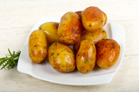 Young baked potato with rosemaryの写真素材