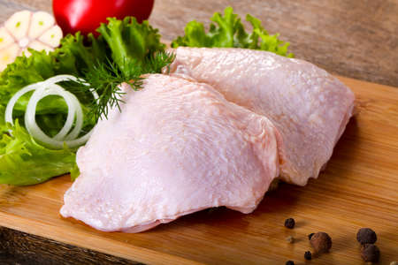 Raw chicken thighs for cookingの写真素材