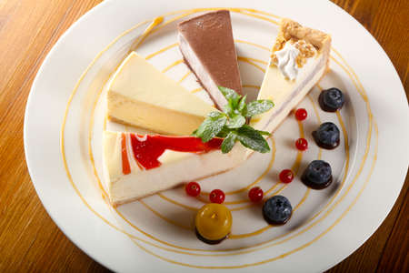 Cheesecake assortment with blueberry and mintの写真素材