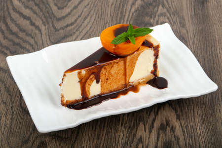 Cheesecake with chocolate and apricotの写真素材