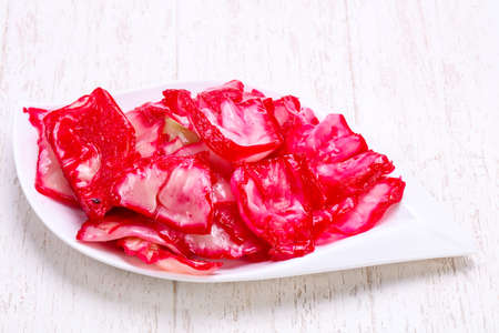 Traditional fermented cabbage sauerkraut in the bowlの写真素材