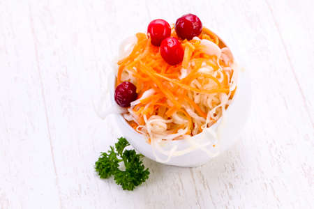 Traditional fermented cabbage sauerkraut in the bowlの写真素材